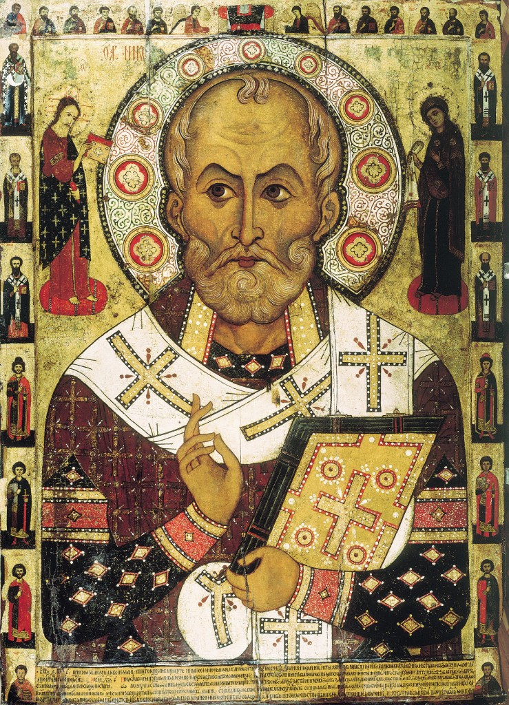 Eastern Orthodox style painting of St Nicholas with his head surrounded by a floral halo as holding a bible. Images of other saints line the painting